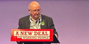 Seamus Dooley at the podium of the TUC Congress