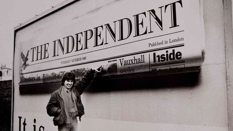 Brian Harris points to a billboard displaying the frontpage of The Independent.