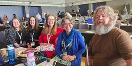 NUJ delegates wearing different coloured tops seated at the TUC Disabled Workers Conference.