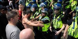 Scene of police being confronted by rioters