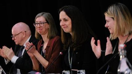 Natasha Hirst, NUJ president, wearing a black blazer opens DM 2025 alongside Seamus Dooley, Laura Davison, and Debbie Cavaldoro.
