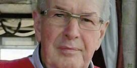 Paddy Clancy wearing glasses and a red jumper.